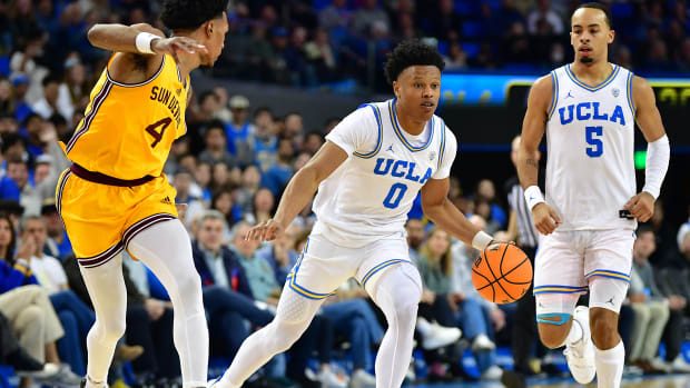 Mar 2, 2023; Los Angeles, California, USA; UCLA Bruins guard Jaylen Clark (0) moves the ball ahead of Arizona State Sun Devils guard Desmond Cambridge Jr. (4) during the second half at Pauley Pavilion.